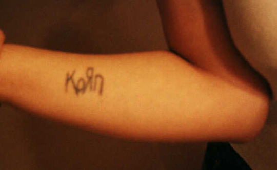 Yes, that IS my arm, and YES, that IS a KoRn tattoo:) Told ya I love em! I've had that since I was 14 or 15.