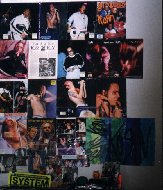 See that picture in the very middle, where Jon is leaning back? That is my VERY FAVORITE picture ever of him. This is the end of my KoRn wall.. It's the 2nd wall portion...NOW it goes all the way to a 3rd wall. I should take some pictures of the rest of it soon.