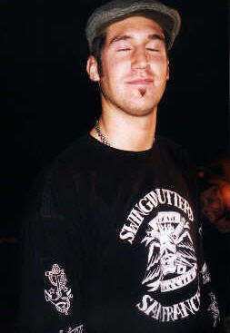 Ryan, MadCaddies old merch guy.  Last I heard, he went on to college, and quit the band merch business. Nice picture:)